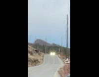 Guy struggles to change flat tire 