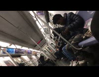 Guy rolls a blunt on subway train and licks it to seal