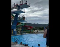 Guy jumps off diving platform lands on butt