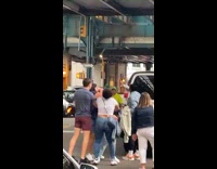 People in altercation and guy puts woman in chokehold
