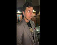 Guy shows his trunk full of DVDs