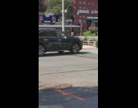 man with black top hat and fire on a stick