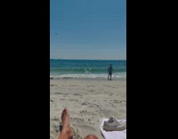 Boy crossed arms captain hat pose at the beach