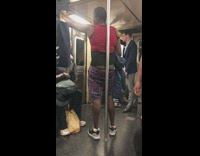 Guy puts his buttcrack against pole on subway train