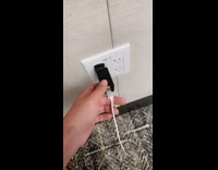 Black wall charger breaks and then sparks 