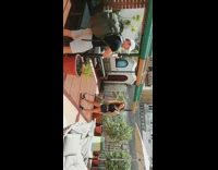 Black shirt girl skateboard hostel white umbrella 