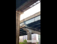 Blue shirt guy haircut sidewalk underpass mirror  