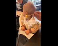 Toddler eavesdropping at restaurant 