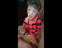Kid has put lots of powder on face