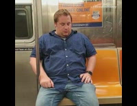 Guy falls asleep then wakes up with a sniff on subway train, then falls down on seat