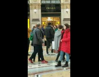 Woman in red jacket picture Prada