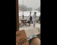 Woman white sweater flex butt snowy mountain