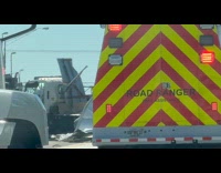 Truck flipped sideways accident on the road