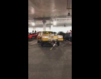 Yellow car hydraulic suspension bounce parking garage