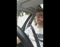 Guy brushes teeth while driving 