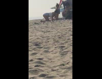 White shirt blue shorts girl beach tent 