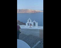 Man carry woman on shoulders roof santorini