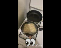 Ramen cooking inside of crooked and bent pot in hot water