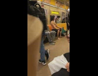 Shirtless guy on subway meditating 