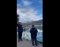 Boy with cigar selfies at the lake