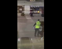 Band members see Southwest employee drop fragile cargo 