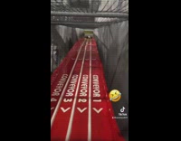 Woman with too much momentum flies off of giant slide 