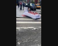 Man drives with customized bed on street
