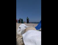 Collab WINY - Coworkers argue at beach green shirts umbrella 