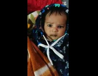 Black sweater baby looks angry or mad