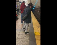 Guy does step dance in subway station