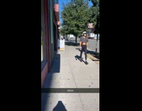 Guy does weird moves on a tree on street