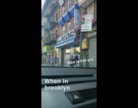 Man in suit shoots confetti cannon on sidewalk than walks away