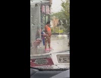 Orange bikini lady sidewalk cart rainbow rain 
