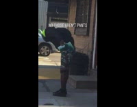 Guy spray paints camouflage print onto himself 