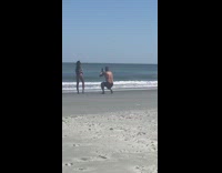 Woman pink bikini hair flip video shoot