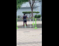 Collab WINY - Woman stands on water fountain 