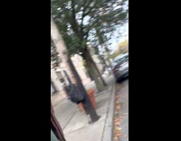 Woman guard dance at day on the street in NY 