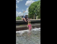 Little girl pink kid bikini waterfall fountain