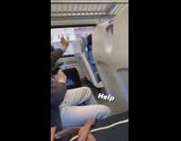 Business Man Does Martial Arts Move on Train Ride 