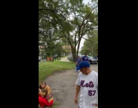 Collab Winy - Woman takes picture candle shrine at park