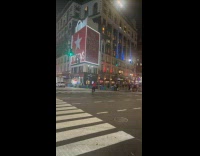 Man ride bike with tv on head 