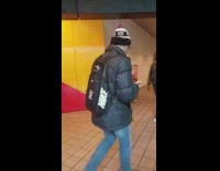 Guy black pants blue tank top punching fighting wall