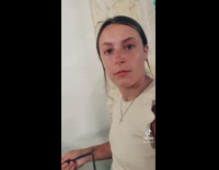 Girl puts pizza tray table in her ripped jeans