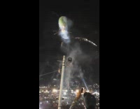 Green hot air balloon red white fireworks 