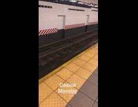 Pair of overall jeans pants on subway train tracks