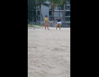 Two girls take selfie on beach