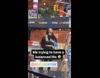 Girl juggles three pins while walking sidewalk 