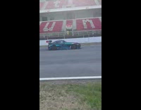 Race car speeds down track 