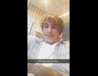 Guy holds kitten in arm first date 