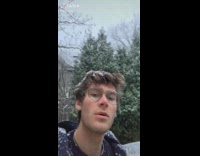 Guy outside snowball drops on face